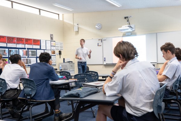A photo of me lecturing at the Christ Church Grammar School taken by Ben Lim. Seven students are visible.